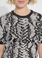 Load image into Gallery viewer, Crafted from the naturally elastic Knit Jacquard, the Preston Knit Short Sleeve Sweater features a ribbed neckline, side slits, and a delicate hint of shimmering Silver Lurex. This lightweight, transitional sweater is versatile enough for both casual and dressy occasions. It has a fitted shoulder design that leads to a straight body silhouette.