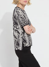 Load image into Gallery viewer, Crafted from the naturally elastic Knit Jacquard, the Preston Knit Short Sleeve Sweater features a ribbed neckline, side slits, and a delicate hint of shimmering Silver Lurex. This lightweight, transitional sweater is versatile enough for both casual and dressy occasions. It has a fitted shoulder design that leads to a straight body silhouette.