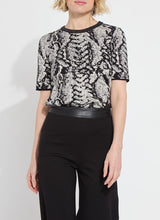 Load image into Gallery viewer, Crafted from the naturally elastic Knit Jacquard, the Preston Knit Short Sleeve Sweater features a ribbed neckline, side slits, and a delicate hint of shimmering Silver Lurex. This lightweight, transitional sweater is versatile enough for both casual and dressy occasions. It has a fitted shoulder design that leads to a straight body silhouette.