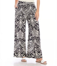 Load image into Gallery viewer, Experience the classic charm of the deco monotone print with our Print Wide Leg Pants in Black and White by Karen Kane. This refined pattern perfectly complements the wide-leg silhouette and features a flowy design and soft viscose fabric for effortless style and unrestricted movement. Elevate your wardrobe with this elegant and functional piece.