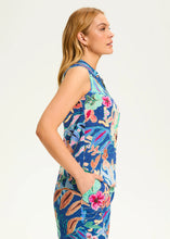 Load image into Gallery viewer, Unleash your creativity with this versatile floral sleeveless shirt. Whether tucked in, tied in front, or worn open over a tank, its endless styling options make it a wardrobe must-have. Designed with a V-neckline and crafted from 100% cotton, this breathable and lightweight piece ensures all-day comfort while keeping you effortlessly chic.