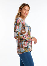 Load image into Gallery viewer, The exquisite floral print and classic v-neckline render this sweater an essential item for the season. A dazzling array of colors merges to form a striking floral composition. Pair it with your cherished denim or elevate the look with a skirt or trousers.