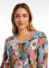Load image into Gallery viewer, The exquisite floral print and classic v-neckline render this sweater an essential item for the season. A dazzling array of colors merges to form a striking floral composition. Pair it with your cherished denim or elevate the look with a skirt or trousers.