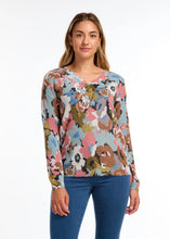 Load image into Gallery viewer, The exquisite floral print and classic v-neckline render this sweater an essential item for the season. A dazzling array of colors merges to form a striking floral composition. Pair it with your cherished denim or elevate the look with a skirt or trousers.