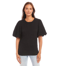 Load image into Gallery viewer, This chic top features a unique bubble texture that adds dimension and style to any outfit. The flattering puff sleeves bring a feminine charm, while the versatile black color makes it easy to dress up or down. Crafted with a soft and stretchy fabric blend, it offers both comfort and sophistication for any occasion.