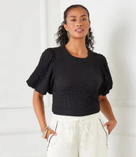 Load image into Gallery viewer, This chic top features a unique bubble texture that adds dimension and style to any outfit. The flattering puff sleeves bring a feminine charm, while the versatile black color makes it easy to dress up or down. Crafted with a soft and stretchy fabric blend, it offers both comfort and sophistication for any occasion.