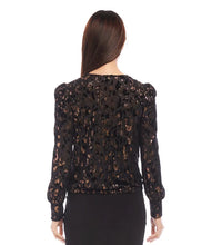 Load image into Gallery viewer, Discover our puff sleeve top, crafted from sumptuous velvet burnout knit and adorned with a chic cheetah print. The metallic foil detail infuses a hint of glamour, complemented by the contemporary twist front design. This top's elastic fabric ensures a blend of fashion and comfort.