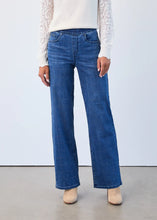 Load image into Gallery viewer, Model wearing blue and silver check wide legs jeans, white lace top and tan suede boots against a plain background.