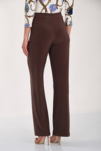 Load image into Gallery viewer, A model is shown from the back wearing pull on, straight-leg brown trousers, a patterned blouse, and nude high heels against a plain white studio background.