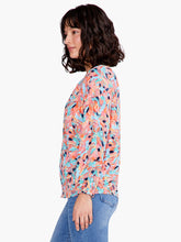 Load image into Gallery viewer, Take a peek at your new favorite colorful top for dressing up or down. Beautiful spring/summer colors pop on this fabulous top includes a keyhole negative space detail that draws the eye. An easy fitting round neck top with 3/4 elastic cuff sleeves complete the look. Designed to sit slightly below the hip. Colors- Blues, orange, coral, pink, black. Easy fit. Round neck. 3/4 sleeve. Bishop sleeve.