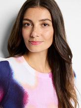 Load image into Gallery viewer, Expertly crafted to bring your style to life, the Nic & Zoe Blossom Blur Sweater adds a touch of vibrant color to your wardrobe. Its exquisite hazy floral print is built to last, making it the ideal knit for chilly days. This sweater is thoughtfully designed to match and enhance denim ensembles, with intricate plaited texture along the hem, collar, and cuffs. Made with fully fashioned knitwear techniques, this style is mindful of minimizing textile waste.