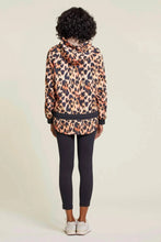 Load image into Gallery viewer, Prepare for the unpredictable weather of spring and summer with a versatile windbreaker and rain jacket. Stay warm and dry on cool, windy, and rainy days with this lightweight and reversible design. Choose between a chic tan color with black stripes or a bold black and orange animal print pattern. A must-have addition to any wardrobe.