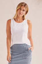 Load image into Gallery viewer, This basic sleeveless tank in white has been elevated to new levels with lace detailing across the chest and down one side of the back. We also love the stretch binding at the neck and armholes for added comfort, the pop-over scoop neckline, and its breeze-friendly sleeveless design. Color- White.