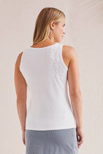 Load image into Gallery viewer, This basic sleeveless tank in white has been elevated to new levels with lace detailing across the chest and down one side of the back. We also love the stretch binding at the neck and armholes for added comfort, the pop-over scoop neckline, and its breeze-friendly sleeveless design. Color- White..