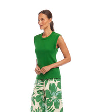 Load image into Gallery viewer, Woman wearing a green sleeveless top and floral and leaf-patterned pants on a white background.