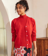 Load image into Gallery viewer, Woman wearing a red cardigan and red turtleneck and printed skirt against a neutral background.