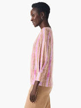 Load image into Gallery viewer, Nic & Zoe has once again exceeded expectations with their latest addition, the Rolling Dunes Sweater. This versatile piece has the appearance of a woven top, but surprises with its lightweight sweater material and a unique printed design in a striking pink and tan on a jersey knit base. Designed with an effortlessly flattering fit and a drapey feel, this sweater features an inverted pleat detail above the 3/4 sleeve cuffs for an added touch of sophistication.