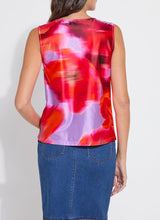 Load image into Gallery viewer, Elevate your wardrobe with the Rosario Draped Printed Top by Lysse, a captivating blend of elegance and effortless charm. Adorned with a floating floral print in a stunning color combination, this piece flows with a graceful drape that flatters every movement. Crafted for both comfort and sophistication, its soft, luxurious fabric and chic silhouette make it a versatile staple—perfect for day-to-night styling. Whether paired with tailored trousers or sleek denim, this top is designed to turn heads.