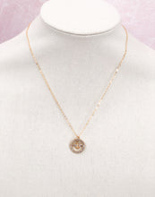 Load image into Gallery viewer, The Rosemary necklace is a stunning piece, featuring a vintage designer button adorned with sparkling rhinestones. Its delicate gold chain adds an extra touch of brilliance. Whether worn alone or layered with other necklaces, this modern piece adds the perfect amount of shine to any outfit, from a simple tee and jeans to a more dressed-up look.