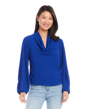 Load image into Gallery viewer, This stunning top in a striking blue color, exudes modern elegance with its luxurious moss crepe fabric that drapes gracefully and flatters the figure. With a sophisticated cowl neck, this top is suitable for both formal and casual occasions. Color- Royal blue. Cowl neck. Blouson sleeves. Elasticized cuffs. Fabric - Moss Crepe: 100% Polyester.