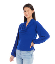 Load image into Gallery viewer, This stunning top in a striking blue color, exudes modern elegance with its luxurious moss crepe fabric that drapes gracefully and flatters the figure. With a sophisticated cowl neck, this top is suitable for both formal and casual occasions. Color- Royal blue. Cowl neck. Blouson sleeves. Elasticized cuffs. Fabric - Moss Crepe: 100% Polyester.
