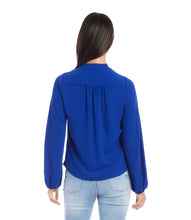 Load image into Gallery viewer, This stunning top in a striking blue color, exudes modern elegance with its luxurious moss crepe fabric that drapes gracefully and flatters the figure. With a sophisticated cowl neck, this top is suitable for both formal and casual occasions. Color- Royal blue. Cowl neck. Blouson sleeves. Elasticized cuffs. Fabric - Moss Crepe: 100% Polyester.