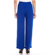 Load image into Gallery viewer, These wide leg pants effortlessly blend style with comfort, thanks to the elasticized waistband providing a flattering and comfortable fit. It's the ideal fusion of fashion and functionality. Color - Royal blue. Full length. Wide-leg. Elasticized waistband. Inseam: 30 inches (size M). Front rise: 13 1/8 inches (size M). Leg Opening: 25 inches (size M). Fabric -Moss Crepe: 100% Polyester.