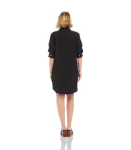 Load image into Gallery viewer, Woman wearing a black shirt dress and sandals on a white background.