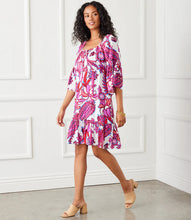 Load image into Gallery viewer, The Raela Ruffle Hem Dress by Karen Kane is the perfect blend of boho chic and timeless elegance. Featuring a floral print in a peony paisley design, this flowy bell sleeve dress offers a lightweight viscose fabric for effortless comfort. The tassel tie neckline adds a delicate touch, while the ruffle hem midi length enhances movement and charm.