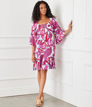Load image into Gallery viewer, The Raela Ruffle Hem Dress by Karen Kane is the perfect blend of boho chic and timeless elegance. Featuring a floral print in a peony paisley design, this flowy bell sleeve dress offers a lightweight viscose fabric for effortless comfort. The tassel tie neckline adds a delicate touch, while the ruffle hem midi length enhances movement and charm.