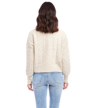 Load image into Gallery viewer, This cardigan sweater features intricate, textured yarns that form a sophisticated cable knit pattern. An ageless piece, it can be dressed up or worn casually for any occasion. Color- Sand. Long sleeve. Button down. Cable knit.