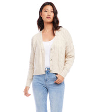 Load image into Gallery viewer, This cardigan sweater features intricate, textured yarns that form a sophisticated cable knit pattern. An ageless piece, it can be dressed up or worn casually for any occasion. Color- Sand. Long sleeve. Button down. Cable knit.