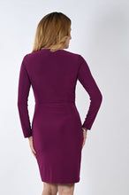 Load image into Gallery viewer, This captivating wrap dress truly elevates any look with its sophisticated yet comfortable wrap front. The shimmering rhinestone brooch adds a luxurious edge to the figure-hugging design, making for a stunningly alluring piece. Show-stopping elegance and glamour await with this dazzling wrap dress. Color- Sangria. Wrap front. Long sleeves. Rhinestone brooch. Fabric -95% Polyester. 5% Elastane.
