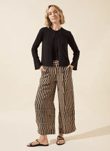 Load image into Gallery viewer, Refined and effortlessly chic, the Santana Pleated Trouser by Lysse is a modern wardrobe essential designed for the woman who values both comfort and sophistication. Crafted from breathable Stretch Woven fabric with 2X stretch, these trousers feature a flattering wide-leg silhouette, deep front pleats, and a concealed tricot front panel that smooths and shapes. The elasticized back waistband ensures a flexible fit, while functional side pockets with mesh facing reduce bulk without sacrificing practicality.