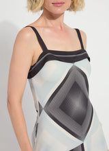 Load image into Gallery viewer, Woman wearing a black and white patterned dress on a white background.