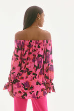 Load image into Gallery viewer, Elevate your ensemble with this stunning satin top, adorned with captivating print. The off-shoulder neckline exudes allure, while the gathered statement sleeves add a touch of sophistication. Designed in a relaxed with a high-low hem, it offers an effortlessly chic appeal. This is part of Joseph Ribkoff's Signature collection.