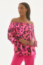 Load image into Gallery viewer, Elevate your ensemble with this stunning satin top, adorned with captivating print. The off-shoulder neckline exudes allure, while the gathered statement sleeves add a touch of sophistication. Designed in a relaxed with a high-low hem, it offers an effortlessly chic appeal. This is part of Joseph Ribkoff's Signature collection.