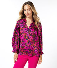 Load image into Gallery viewer, This elegant blouse is crafted from a luxuriously soft satin and features a button-up design with a shirt collar, and delicate pleating on its long-cuffed sleeves. Its versatility allows it to be worn for work and leisure alike. Color - Magenta, pink and coral. Floral print. Button down. Shirt collar. Subtle pleat detailing on sleeves. Long cuffed sleeves.