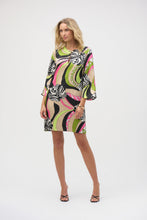 Load image into Gallery viewer, Admire the incomparable style of this stunning satin dress. The fabric showcases a vibrant retro print on a classic straight silhouette. The features a chic slit neckline adorned with gold ornaments, adding a hint of glamour to the design. The three-quarter bell sleeves complete the piece's polished look.