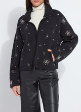 Load image into Gallery viewer, Model wearing a charcoal grey jacket with rhinestone snowflake patterns, white turtleneck and black pants against a white background.
