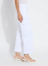 Load image into Gallery viewer, Shop the Scout High Waist Cuffed Cargo Pants - Crafted with premium 4-way stretch Knit Denim for ultimate comfort and style. Featuring classic cargo design with patch and side pockets for a slimming effect, plus a back yoke and belt loops. These high-waisted, wide-leg pull-on pants include a patented concealed waistband for a sleek fit. Wear cuffed or uncuffed to match your style and mood.