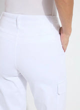 Load image into Gallery viewer, Shop the Scout High Waist Cuffed Cargo Pants - Crafted with premium 4-way stretch Knit Denim for ultimate comfort and style. Featuring classic cargo design with patch and side pockets for a slimming effect, plus a back yoke and belt loops. These high-waisted, wide-leg pull-on pants include a patented concealed waistband for a sleek fit. Wear cuffed or uncuffed to match your style and mood.