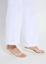 Load image into Gallery viewer, Shop the Scout High Waist Cuffed Cargo Pants - Crafted with premium 4-way stretch Knit Denim for ultimate comfort and style. Featuring classic cargo design with patch and side pockets for a slimming effect, plus a back yoke and belt loops. These high-waisted, wide-leg pull-on pants include a patented concealed waistband for a sleek fit. Wear cuffed or uncuffed to match your style and mood.