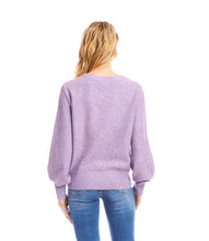 Load image into Gallery viewer, Woman wearing a purple sequin sweater and blue jeans against a white background.