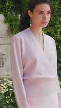 Load image into Gallery viewer, Woman wearing a light pink sweater and earrings in an outdoor setting with greenery.