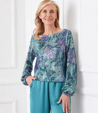 Load image into Gallery viewer, Enhance your wardrobe with our boatneck top, radiating bold sophistication. It features a vibrant floral print adorned with sparkling sequins, made from luxurious Italian fabric. This top complements a variety of bottoms, including your go-to denim. Stand out in style with this exquisite piece.