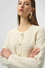 Load image into Gallery viewer, Close-up of model wearing gold statement earrings and winter white and gold cardigan with gold buttons against a white background.