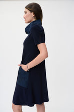 Load image into Gallery viewer, Step into timeless elegance with the Joseph Ribkoff Midnight Blue Dress—a must-have for effortless sophistication. Crafted from a luxurious stretchy fabric, this knee-length A-line dress offers a comfortable fit with front pockets and a stylish cowl-neck and drawstring detail. Perfect for casual outings or elevated occasions, its polyester-spandex blend ensures a flattering silhouette while keeping you comfortable all day long.