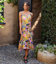 Load image into Gallery viewer, Experience a chic and comfortable look with this Taryn Tropical Flower Print Side Slit Dress from Karen Kane. The adjustable straps and midi length offer a customizable fit for a flattering silhouette, combining style and tropical vibes in one eye-catching piece. Color- Island flower print; V-neckline. Adjustable straps. Side pockets.