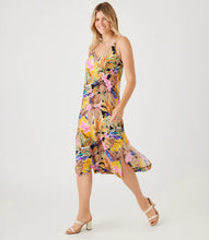 Load image into Gallery viewer, Experience a chic and comfortable look with this Taryn Tropical Flower Print Side Slit Dress from Karen Kane. The adjustable straps and midi length offer a customizable fit for a flattering silhouette, combining style and tropical vibes in one eye-catching piece. Color- Island flower print; V-neckline. Adjustable straps. Side pockets.
